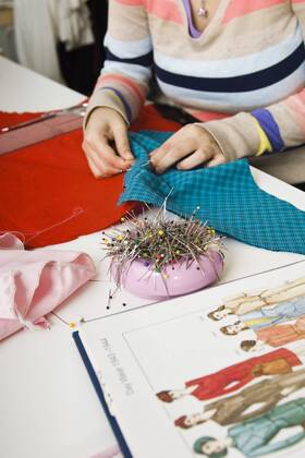 Preparing fabric for sewing project  Copyright: MichèlexConstantini B74891806