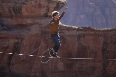 Andy Lewis highlining in Moab Utah, Moab Utah United States Copyright: JaredxAlden 4517100019