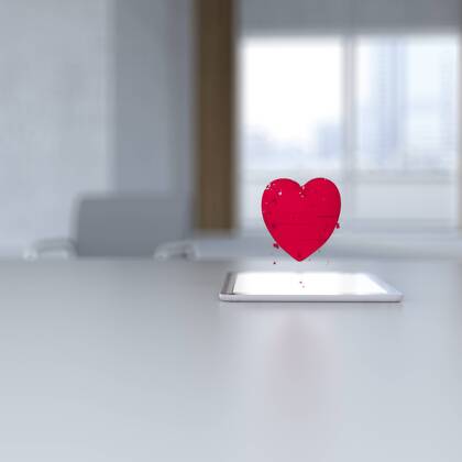 3D rendering, Pixel heart hovering over digital tablet on desk  UWF01424