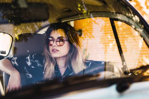 Young woman wearing sunglasses sitting in a car model released Symbolfoto  KKAF01353