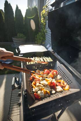 Person cooking vegetables on barbecue grill, Surrey British Columbia Canada model released Symbolfoto property released Copyright: ChristopherxKimmel KICH014979