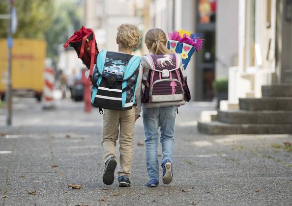 Two children with school bag on their way to school from behind model released Copyright: xMEVx ALLMV137016