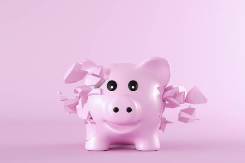 3D Rendering, Piggy bank bursting into pieces in front of pink background  AHUF00533