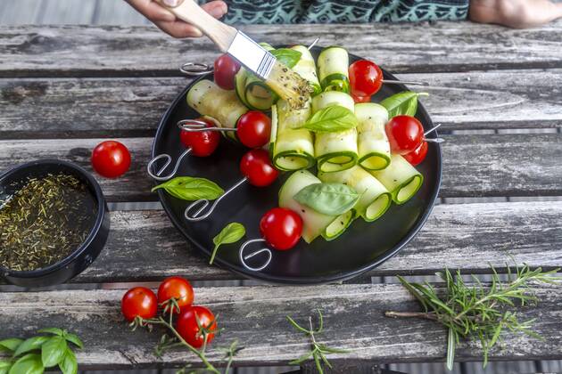 Vegetarian grill skewers, tomato and zucchini slices, brush with rosemary garlic oil model released Symbolfoto  SARF03938