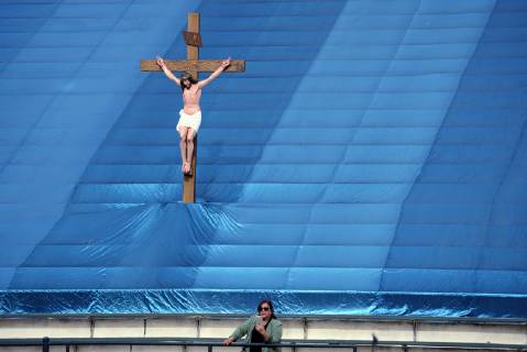 December 9, 2018 - Los Angeles, California, United States - A woman and a statue of Jesus Christ are seen as during the 87th Annual Procession in honor of Our Lady of Guadalupe in Los Angeles, California on December 9, 2018. The Catholic procession is the oldest religious procession in Los Angeles and celebrates the apparition of the Virgin Mary in Mexico in 1531. Los Angeles United States  - ZUMAn230 20181209_zaa_n230_551 Copyright: xRonenxTivonyx