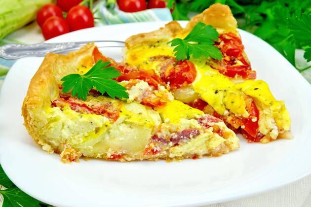  Flan with tomato and zucchini in plate on light board  Copyright: xrezkrrx Panthermedia19422168