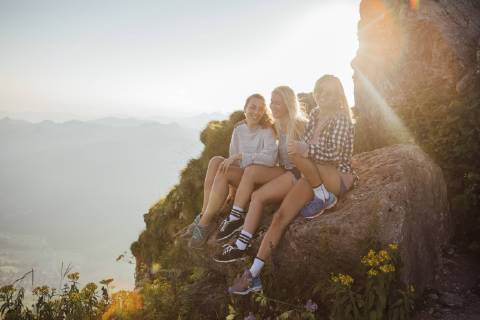 Switzerland, Grosser Mythen, three happy girlfriends on a hiking trip having a break at sunrise model released Symbolfoto  LHPF00052