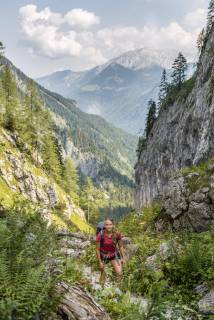 Hiker on a hiking trail View of mountains Saugasse Hiking trail to Königssee and Kärlinger Haus National Park Berchtesgaden Bavaria Germany Europe Copyright: imageBROKER/MoritzxWolf ibxmmw04812711.jpg