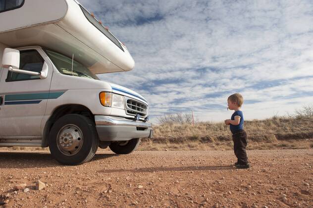Toddler standing in front of motor home  Copyright: JérômexGorin B57912630