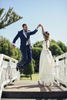 Bridal couple enjoying their wedding day in a park model released Symbolfoto  JSMF00572