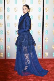 Lily Collins attends the EE British Academy Film Awards at The Royal Albert Hall in London FEBRUARY 10th 2019  PTYx19517