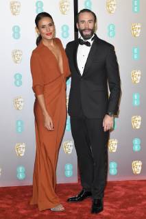 Maria Dolores Dieguez and Joseph Fiennes attend the EE British Academy Film Awards at The Royal Albert Hall in London FEBRUARY 10th 2019  PTYx19517