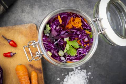 Homemade red cabbage, fermented, with chili, carrot and coriander, in a preserving jar  LVF07654