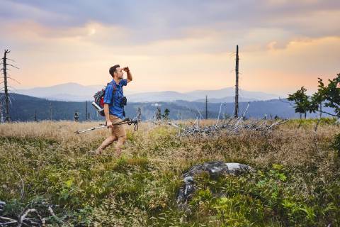 Man hiking in the mountains at dusk model released Symbolfoto  BSZF00754