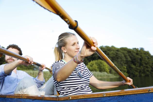 Young couple enjoying a trip in a canoe on a lake model released Symbolfoto  FKF02830