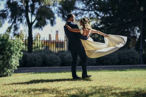 Bridal couple enjoying their wedding day in a park model released Symbolfoto  JSMF00565