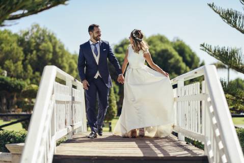 Bridal couple enjoying their wedding day in a park model released Symbolfoto  JSMF00570