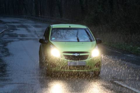 Dangerous road conditions in heavy rain Cars drive due to sudden heavy rainfall and poor visibility Essen Nordrhein Westfalen Germany Germany Überruhr