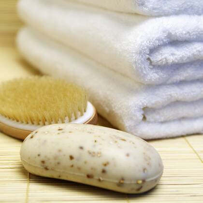 Close up of oatmeal soap, brush and towels Close up of oatmeal soap, brush and towels,Bradenton, Florida, USA  46896