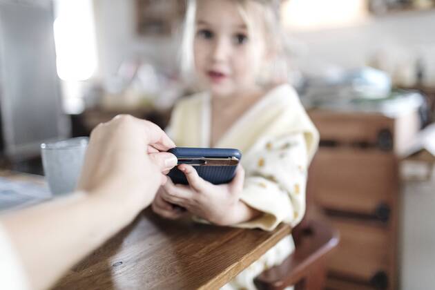 Mother s hand taking away smartphone, close-up model released Symbolfoto property released  KMKF00717