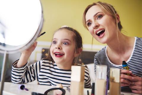 Mother and daughter applying make up together model released Symbolfoto property released  ABIF01203