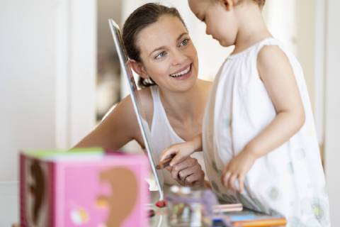 Portrait of smiling mother painting with her little daughter model released Symbolfoto property released  DIGF05845