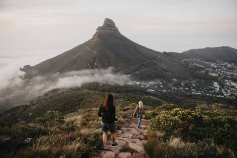 South Africa, Cape Town, Kloof Nek, two women on a trail at sunset model released Symbolfoto  LHPF00307