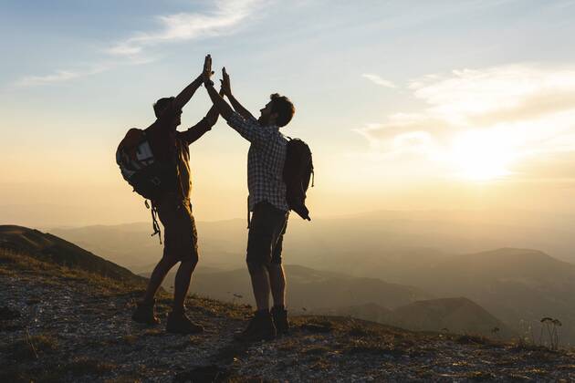 Italy, Monte Nerone, two happy and successful hikers in the mountains at sunset model released Symbolfoto  WPEF01316