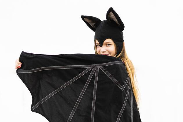 Portrait of girl in bat costume spreading wings model released Symbolfoto property released  ERRF00989