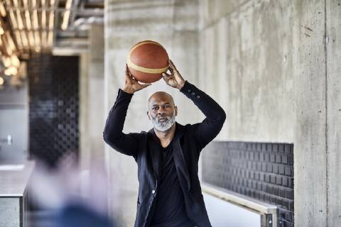 Mature businessman playing basketball in modern office model released Symbolfoto property released  FMKF05505