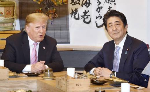 Trump in Japan Japanese Prime Minister Shinzo Abe (R) and U.S. President Donald Trump dine at a Japanese charcoal grill restaurant in Tokyo on May 26, 2019. Accompanied by their respective wives -- Akie and Melania -- the Japanese and U.S. leaders had dinner at Inakaya in the glitzy Roppongi district on the eve of their summit talks.