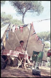 Spain Spain, ca 1956, holidays at the beach, holidays in Spain, man in front of a tent