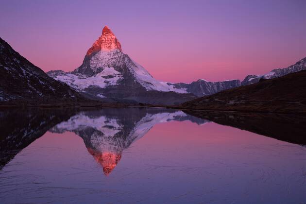 Matterhorn (4,478m) with reflection in Lake Riffel at sunrise, Switzerland, September 2008. WWE BOOK. WWE OUTDOOR EXHIBITION. NOT TO BE USED FOR GREETING CARDS OR CALENDARS *PRESS IMAGE  1281379 WildxWondersxofxEuropexPopp-Hackner