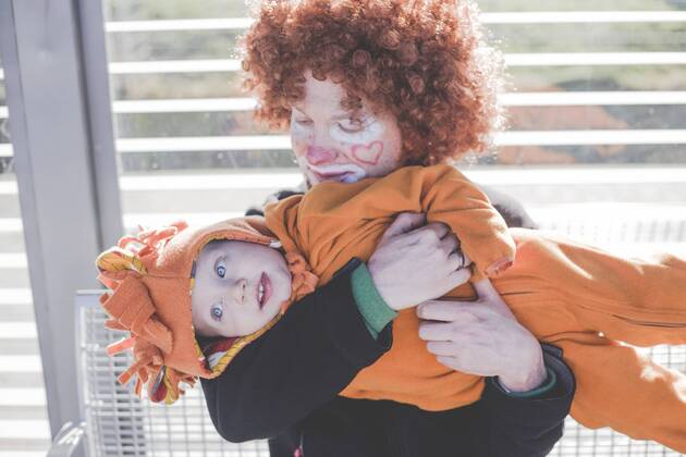 Man dressed up as a clown and little boy dressed up as lion baby at carnival model released Symbolfoto  IHF00086