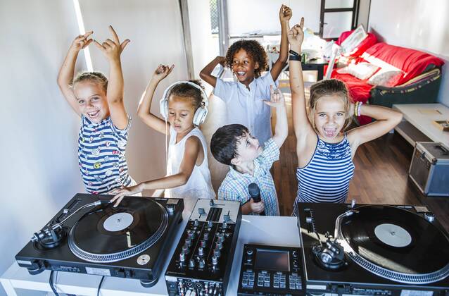 Young friends having a party at the turntable model released Symbolfoto property released  LJF00548