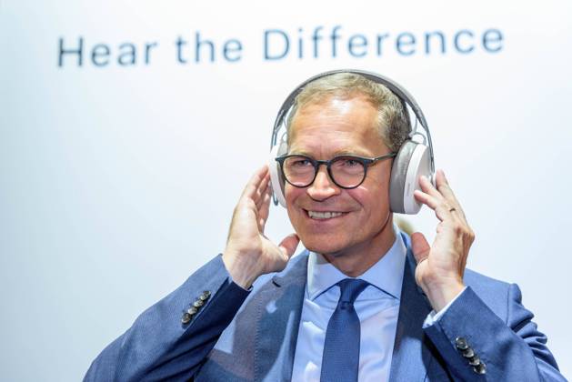 Berlins Governing Mayor Michael Müller SPD with headphones at Sennheisers stand during the opening tour of the IFA International Consumer Electronics Fair at the Berlin Exhibition Grounds snapshot photography F Boillot