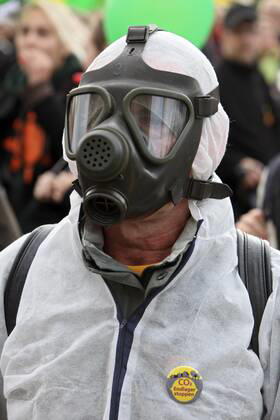 Berlin, Germany Demonstrator with protective mask at the Anti Atomic Power Demo 18 09 2010, Berlin, Germany, DEU Major demonstration of nuclear opponents at the Reichstag in Berlin with the aim of encircling the government district Demonstrator with protective mask Berlin Berlin Germany