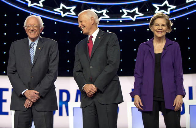 October 15, 2019, Westerville, Ohio, USA: From left, BERNIE SANDERS, JOE BIDEN and ELIZABETH WARREN pose for photographers prior to the Democratic Presidential Debate hosted by CNN and The New York Times and held at Otterbein University. Westerville U.S. - ZUMAce6_ 20191015_zaf_ce6_023 Copyright: xBrianxCahnx