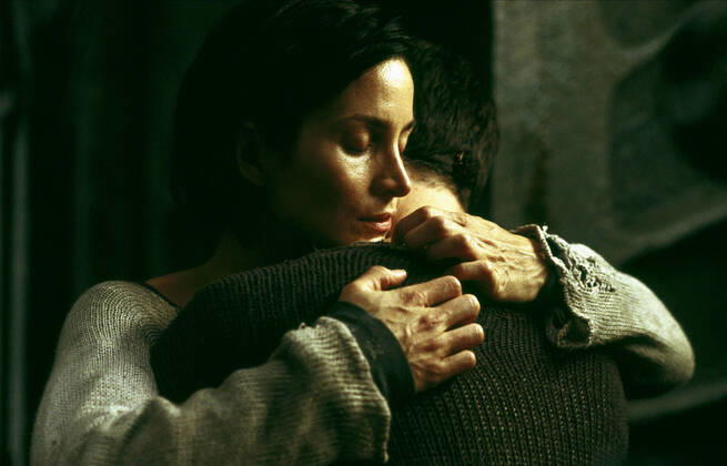 Carrie-Anne Moss & Keanu Reeves Characters: Trinity & Neo Film: The Matrix Revolutions (USA AUS 2003) Director: Andy Wachowski, L. Wachowski 27 October 2003 Copyright: MaryxEvansxAFxArchivexWarnerxBros. 12631034 editorial use only