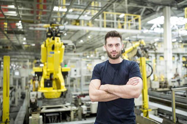 Portrait of confident worker in a modern factory model released Symbolfoto property released WESTF24315