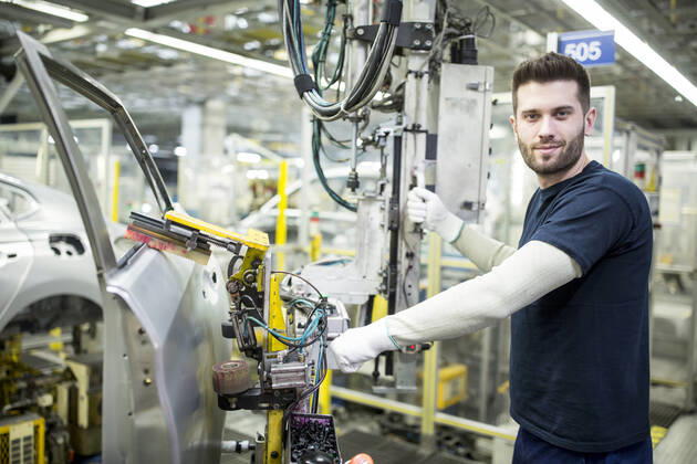 Portrait of confident worker in modern car factory model released Symbolfoto property released WESTF24334