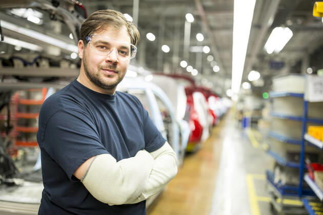 Portrait of confident worker in modern car factory model released Symbolfoto property released WESTF24371