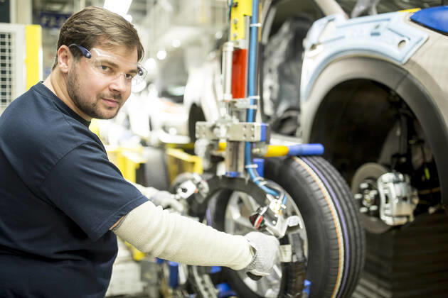 Portrait of confident worker in modern car factory model released Symbolfoto property released WESTF24381