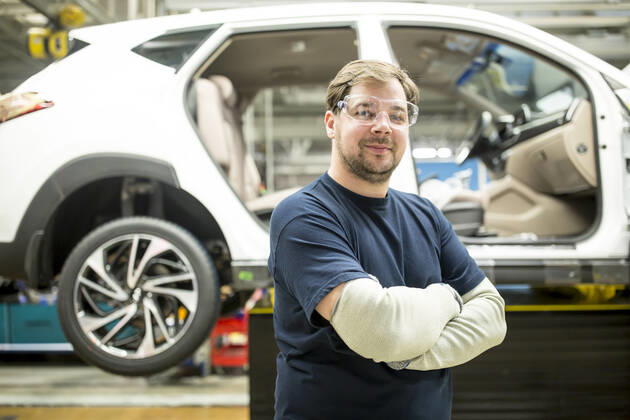 Portrait of confident worker in modern car factory model released Symbolfoto property released WESTF24386