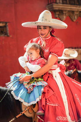January 21, 2020, San Miguel De Allende, Guanajuato, Mexico: A Mexican Cowgirl and her daughter ride horseback in a parade to celebrate the 251st birthday of the Mexican Independence hero Ignacio Allende January 21, 2020 in San Miguel de Allende, Guanajuato, Mexico. Allende, from a wealthy family in San Miguel played a major role in the independency war against Spain in 1810 and later honored by his home city by adding his name. San Miguel De Allende Mexico - ZUMAe02_ 20200121_zaf_e02_021 Copyright: xRichardxEllisx
