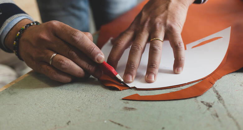 Close up of a shoemaker cutting leather Concept of shoes designer 1085307655