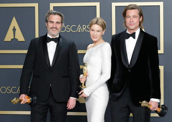 (L-R) Joaquin Phoenix, winner of Best Actor in a Leading Role for Joker, Renée Zellweger, winner of Best Actress in a Leading Role for Judy, and Brad Pitt, winner of Best Actor in a Supporting Role for Once Upon A Time In Hollywood, appear backstage with their Oscars during the 92nd annual Academy Awards at Loews Hollywood Hotel in the Hollywood section of Los Angeles on Sunday, February 9, 2020.  LAP20200209857 JOHNxANGELILLO