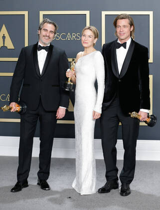 (L-R) Joaquin Phoenix, winner of Best Actor in a Leading Role for Joker, Renée Zellweger, winner of Best Actress in a Leading Role for Judy, and Brad Pitt, winner of Best Actor in a Supporting Role for Once Upon A Time In Hollywood, appear backstage with their Oscars during the 92nd annual Academy Awards at Loews Hollywood Hotel in the Hollywood section of Los Angeles on Sunday, February 9, 2020.  LAP20200209859 JOHNxANGELILLO