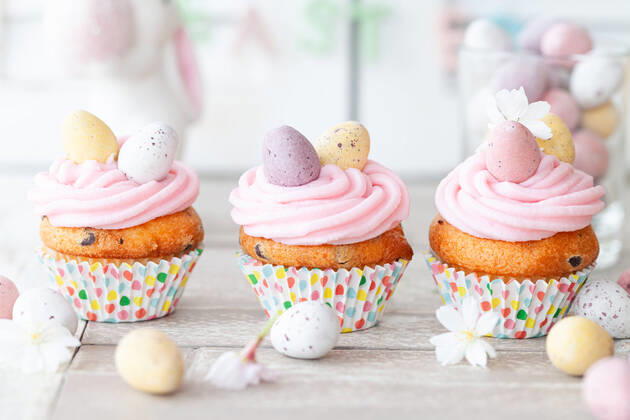 Small cupcakes with pink icing for Easter 1079706042