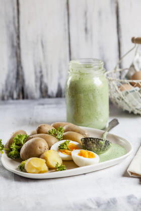 Plate of potatoes with boiled eggs, parsley and salsa verde sauce  SBDF04186